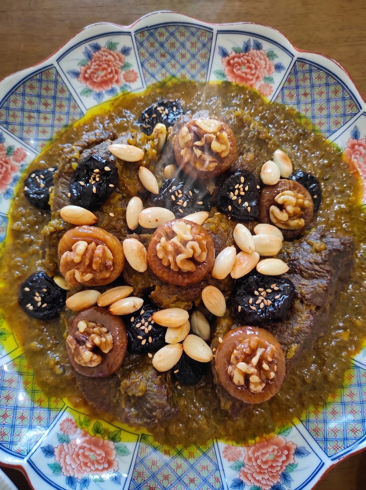 Lham b'barkouk — lamb with prunes, walnuts and sesame seeds